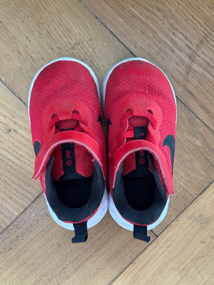 Nike Toddler Shoes Red (Category: Babies & Kids Fashion) located in San Juan City. Submitted by vix13 (Listing ID 1414847854, Image 1). Description: - Nike toddler shoes - Size: US 7C (13cm) - Features: Black Nike swoosh, velcro strap, pull tab at heel - Sole: White - Made in Indonesia - Condition: Shows wear on soles.