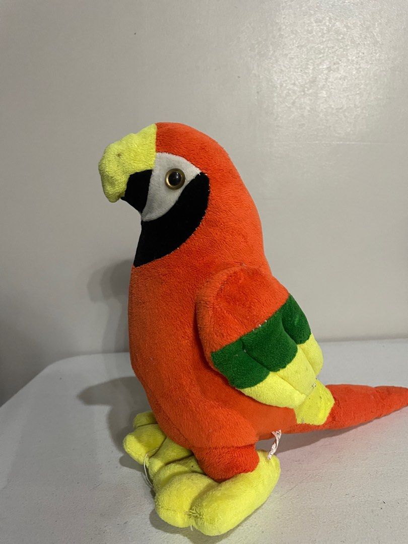 Ocean Park Official Parrot Plush Toy (Category: Plushies & Soft Toys) located in Manila. Submitted by loved.kcarts (Listing ID 1414899839, Image 2). Description: - Colorful parrot plush toy - Orange body - Yellow feet and beak - Green wing accents - Large eyes with black face patch - Soft and cuddly.
