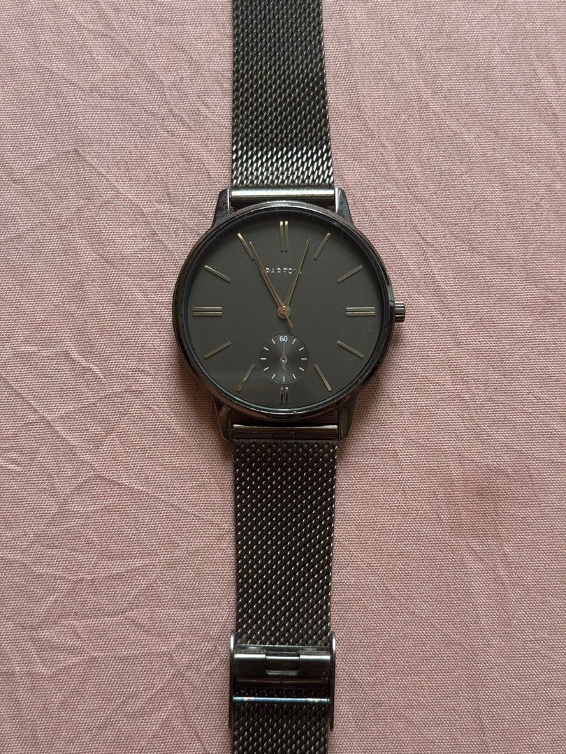 Parfois Stainless Steel Mesh Watch (Category: Women's Watches) located in Manila. Submitted by gelds (Listing ID 1414846355, Image 1). Description: - Stylish Parfois watch - Sleek dark grey face - Stainless steel mesh band - Features a small seconds subdial - "Stainless Steel" band marking - Parfois brand markings on the back - No box.
