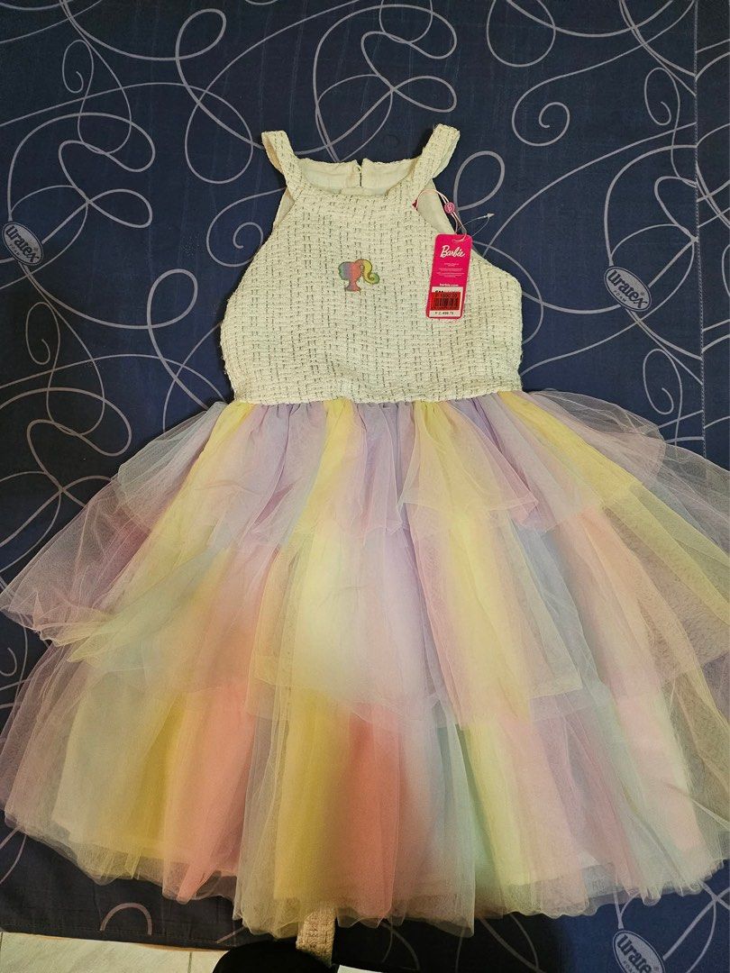 Pre loved dress (Category: Babies & Kids Fashion) located in Bacoor. Submitted by rizza_455 (Listing ID 1414898970, Image 1). Description: Original Barbie dress preloved.once lang nasuot size 10 on tag Fit to 6-7years old.