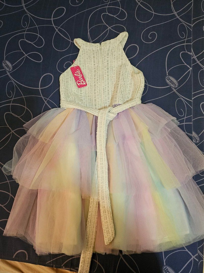Pre loved dress (Category: Babies & Kids Fashion) located in Bacoor. Submitted by rizza_455 (Listing ID 1414898970, Image 2). Description: Original Barbie dress preloved.once lang nasuot size 10 on tag Fit to 6-7years old.