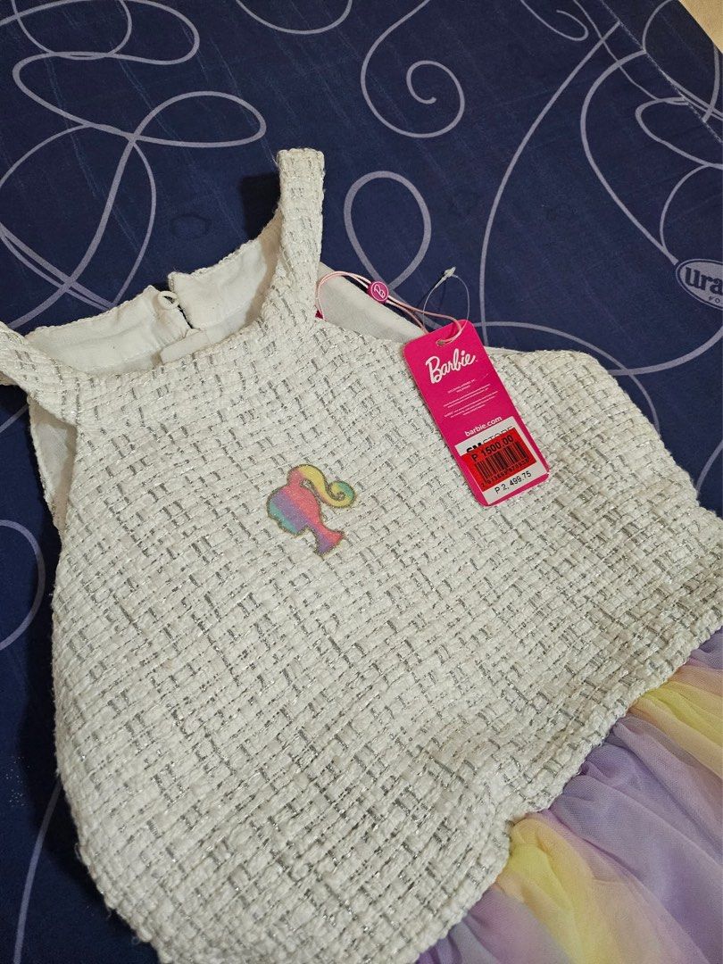 Pre loved dress (Category: Babies & Kids Fashion) located in Bacoor. Submitted by rizza_455 (Listing ID 1414898970, Image 3). Description: Original Barbie dress preloved.once lang nasuot size 10 on tag Fit to 6-7years old.