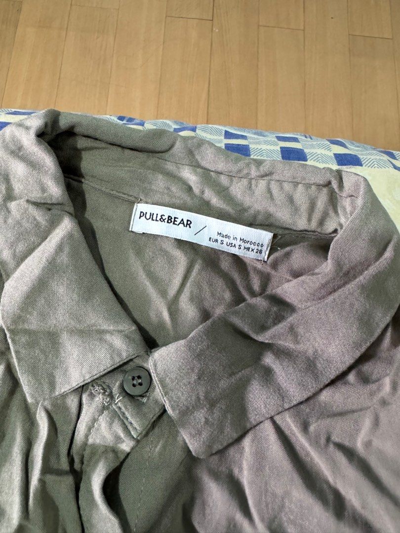 Pull&Bear Longsleeve Top (Category: Shirts) located in Caloocan City. Submitted by daybysunlight (Listing ID 1414894160, Image 2). Description: ♡ can be used as an outerwear or the top itself ♡ size: EUR S / USA S / MEX 26 ♡ neutral color ♡ collared neckline ♡ button-down closure ♡ two front pockets ♡ tie detail at waist ♡ good quality; breathable and comfy ♡ made in morocco ♡ does not fit me anymore.