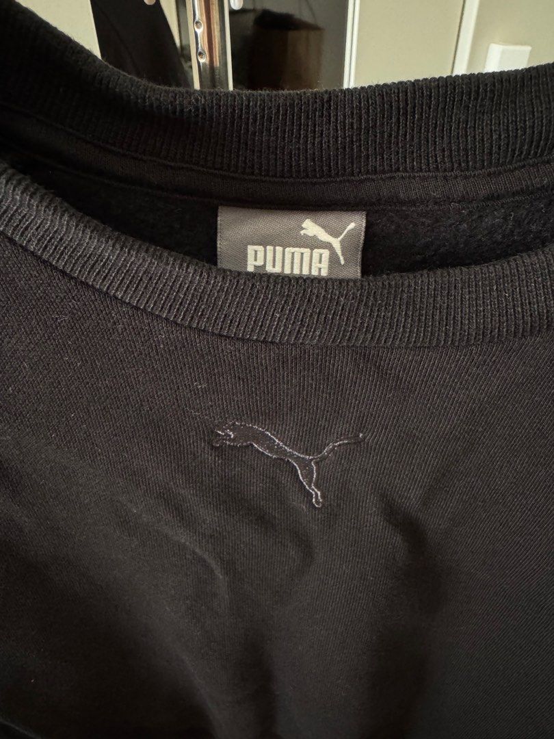 Puma Cropped Sweatshirt (Category: Coats, Jackets and Outerwear) located in San Pedro. Submitted by ajcee (Listing ID 1414843004, Image 2). Description: - Black Puma cropped sweatshirt - Crew neck - Long sleeves - Adjustable drawstring hem - Puma logo on chest - Authentic Puma label inside collar.