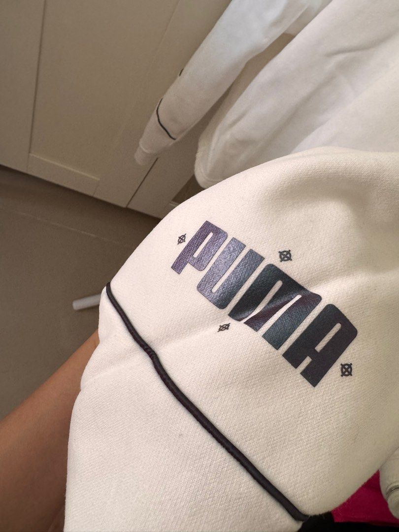 Puma White Hoodie (Category: Coats, Jackets and Outerwear) located in San Pedro. Submitted by ajcee (Listing ID 1414843169, Image 2). Description: - White Puma hoodie - Small Puma logo on chest - Large Puma logo on sleeve - High neckline - Long sleeves with black trim - Authentic Puma brand.