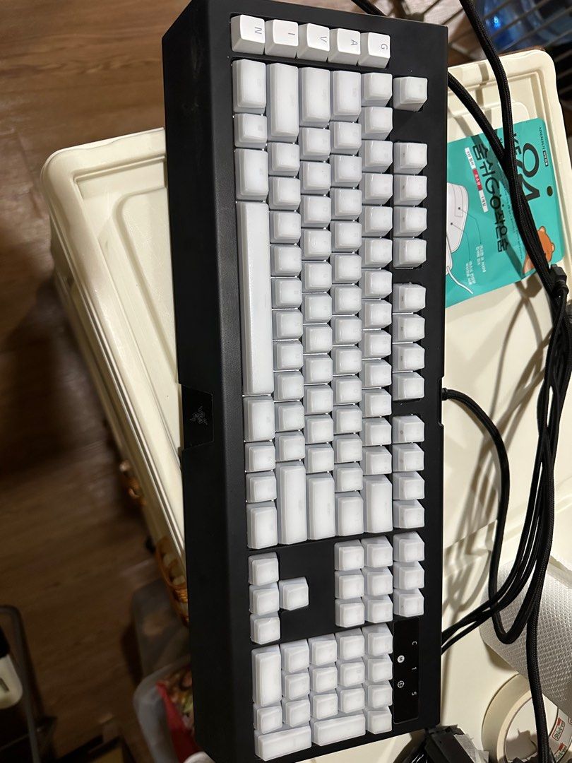 Razer Blackwidow Chroma V2 Keyboard (Category: Computer Keyboard) located in Caloocan City. Submitted by sherwinhui (Listing ID 1414894014, Image 2). Description: - Razer Blackwidow Chroma V2 keyboard - White keycaps - Black frame - Wired connection - Model name visible Key caps well used .