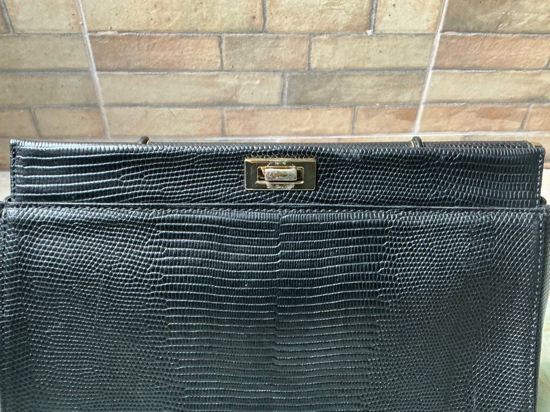 Sisley Black Handbag (Category: Luxury Bags & Wallets) located in Quezon City. Submitted by a_basco (Listing ID 1414963691, Image 3). Description: Honest Issue: Metal Stains lang pero good padin ang condition ng buong bag Qc Area Negotiable Pm for more details.