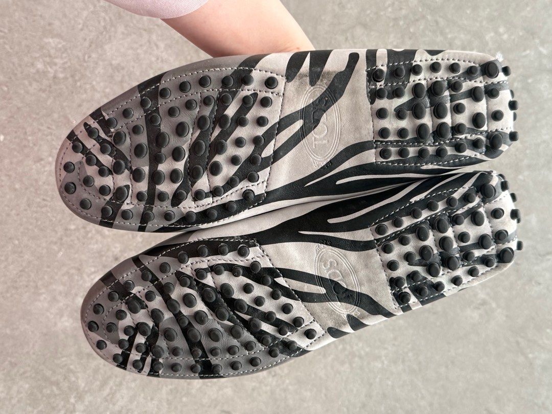 Tod's Zebra Print Loafers - Size 36.5 (Category: Loafers) located in Makati City. Submitted by secondavenue_ (Listing ID 1414830223, Image 2). Description: - Tod's zebra print loafers - Classic Tod's metal detailing - Rubber soles with signature pebble design - Minimal wear on soles and uppers - Size 36.5.