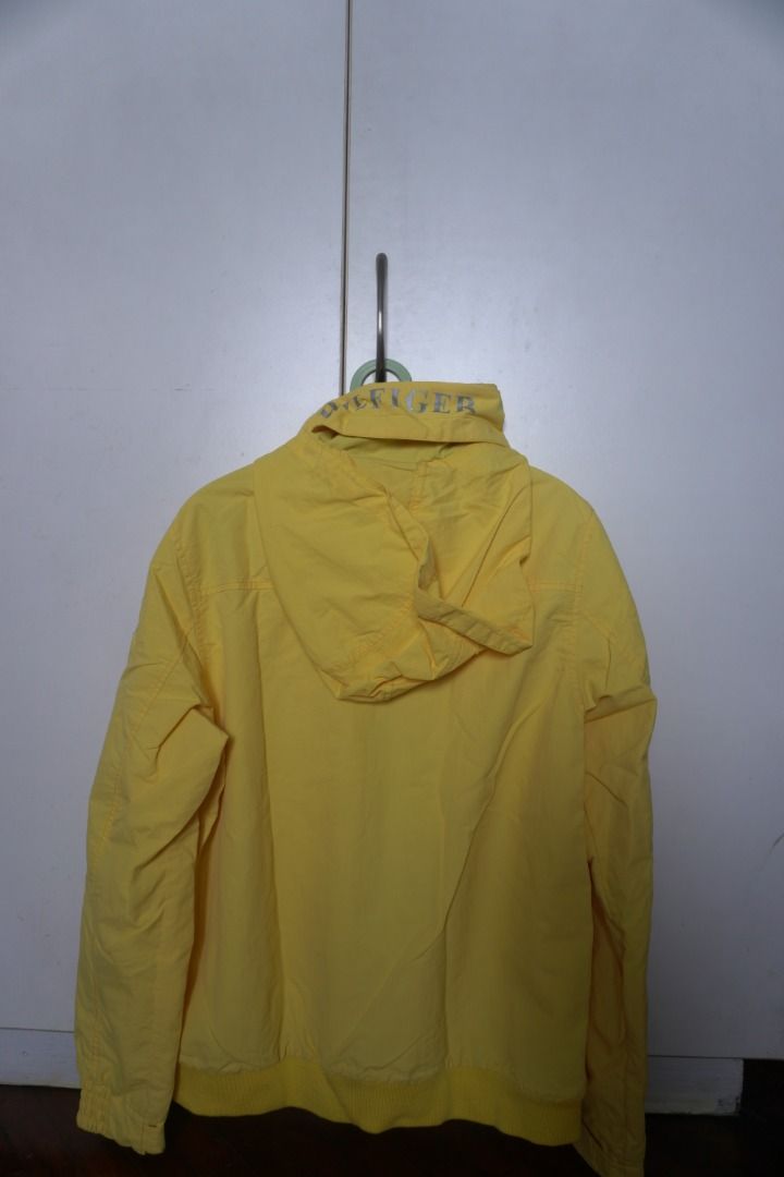 Tommy Hilfiger Yellow Yacht Jacket (Category: Coats, Jackets and Outerwear) located in Manila. Submitted by justanotherconsumer (Listing ID 1414912281, Image 2). Description: Tommy Hilfiger Yacht Jacket With Packable Hood - Yellow - Size: Small - Condition: Like New (9.5+/10) - No issues - Dimensions: 21x26 (inches) Can do meetups around Welcome Rotonda or Lalamove if via delivery around Metro Manila, buyer shoulders sf. DM!.