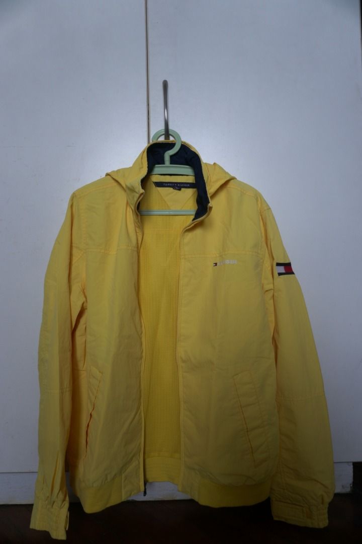 Tommy Hilfiger Yellow Yacht Jacket (Category: Coats, Jackets and Outerwear) located in Manila. Submitted by justanotherconsumer (Listing ID 1414912281, Image 1). Description: Tommy Hilfiger Yacht Jacket With Packable Hood - Yellow - Size: Small - Condition: Like New (9.5+/10) - No issues - Dimensions: 21x26 (inches) Can do meetups around Welcome Rotonda or Lalamove if via delivery around Metro Manila, buyer shoulders sf. DM!.