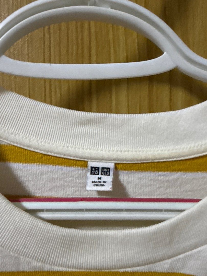 Uniqlo Striped T-shirt - Medium (Category: Shirts) located in Quezon City. Submitted by cleaningmomma (Listing ID 1414991669, Image 2). Description: - Uniqlo striped t-shirt - Color: White and Mustard Yellow - Size: Medium - Features: Round neck, short sleeves - Made in China - Perfect for everyday wear ‼️Payment First before delivery‼️ 📌SF c/o buyer 📌MOP: BDO/GCash 📍Loc: Quezon City.