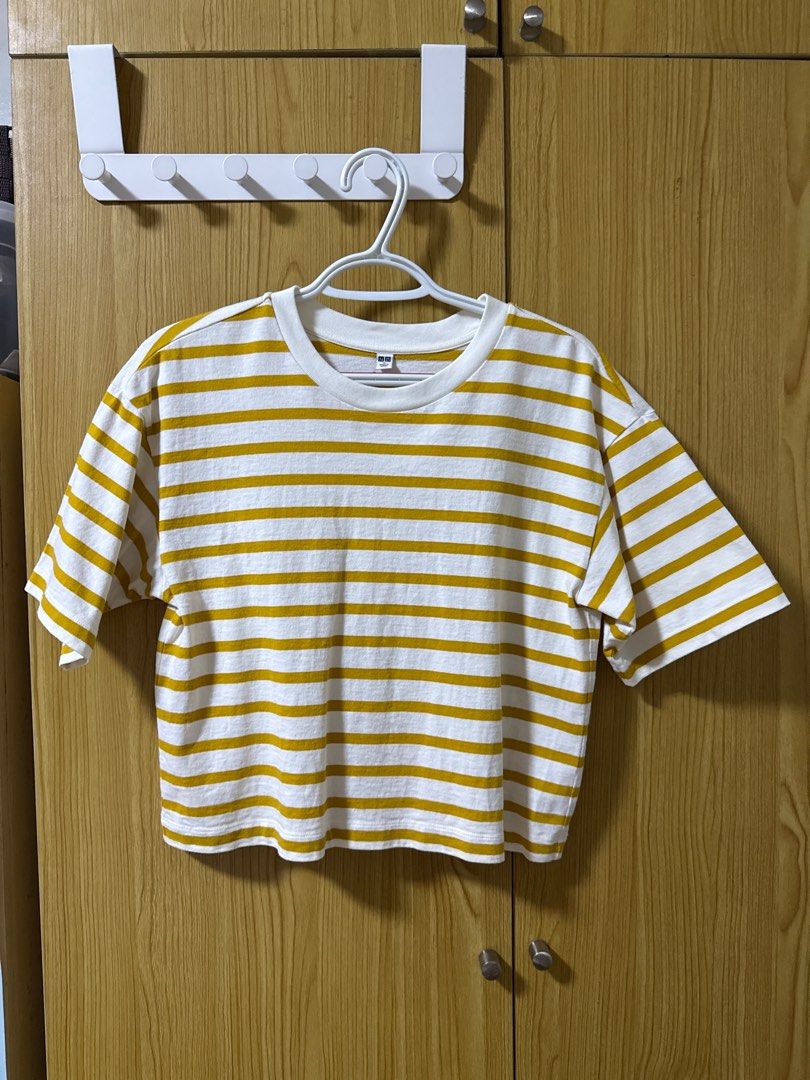 Uniqlo Striped T-shirt - Medium (Category: Shirts) located in Quezon City. Submitted by cleaningmomma (Listing ID 1414991669, Image 1). Description: - Uniqlo striped t-shirt - Color: White and Mustard Yellow - Size: Medium - Features: Round neck, short sleeves - Made in China - Perfect for everyday wear ‼️Payment First before delivery‼️ 📌SF c/o buyer 📌MOP: BDO/GCash 📍Loc: Quezon City.