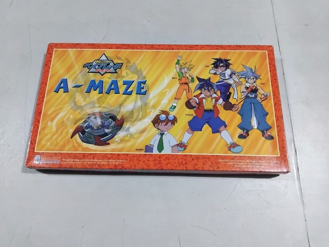 Vintage 2003 Beyblade A-Maze Board Game by Mabuhay (Category: Board Games & Puzzles) located in Marikina City. Submitted by my-an (Listing ID 1414987219, Image 3). Description: - Beyblade A-Maze board game - Includes: game board, game pieces, dice, and instructions - Features Beyblade characters - Made by Mabuhay Board Games - Copyright 2003 - Licensed by d-rights Inc. and MediaLink Pacific Ltd. - Made in the Philippines From our personal collect