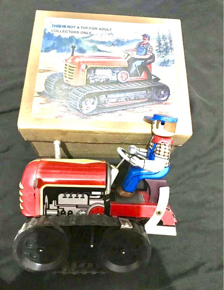 Vintage Wind Up Tin Toy Tractor with Box (Category: Vehicle & Diecast Models) located in Manila. Submitted by beng1964 (Listing ID 1415034146, Image 3). Description: - Vintage tin toy tractor - Includes original box - Red tractor with driver figure - Collectible item.