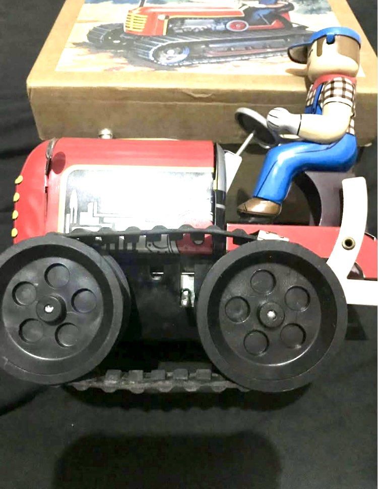 Vintage Wind Up Tin Toy Tractor with Box (Category: Vehicle & Diecast Models) located in Manila. Submitted by beng1964 (Listing ID 1415034146, Image 1). Description: - Vintage tin toy tractor - Includes original box - Red tractor with driver figure - Collectible item.