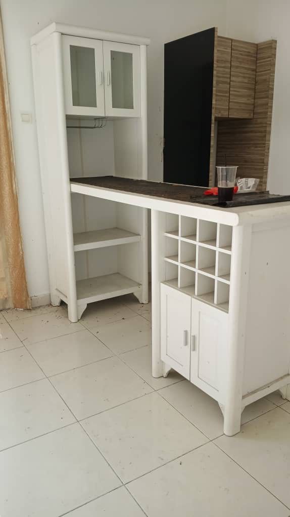 White Bar Cabinet with Wine Rack (Category: Shelves, Cabinets & Racks) located in Kuala Lumpur. Submitted by suriya585 (Listing ID 1414934019, Image 1). Description: - White bar cabinet - Built-in wine rack - Storage cabinets - Countertop and upper cabinet with glass doors - Shelves for storage - Classic design - Ideal for home bars.