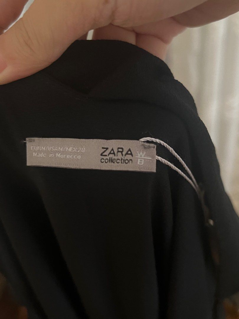 ZARA Black V-Neck Overlay Jumpsuit (Category: Jumpsuits) located in Manila. Submitted by soukcasa (Listing ID 1414903280, Image 3). Description: Size👚: M Brand🛒: Zara Conditon🛍️: Never worn RFS👜: Doesn’t fit A versatile wardrobe staple for any occasion. This black jumpsuit features delicate spaghetti straps and a flattering V-neckline with a tiered ruffle overlay on the bodice. DM me for inquiry!.