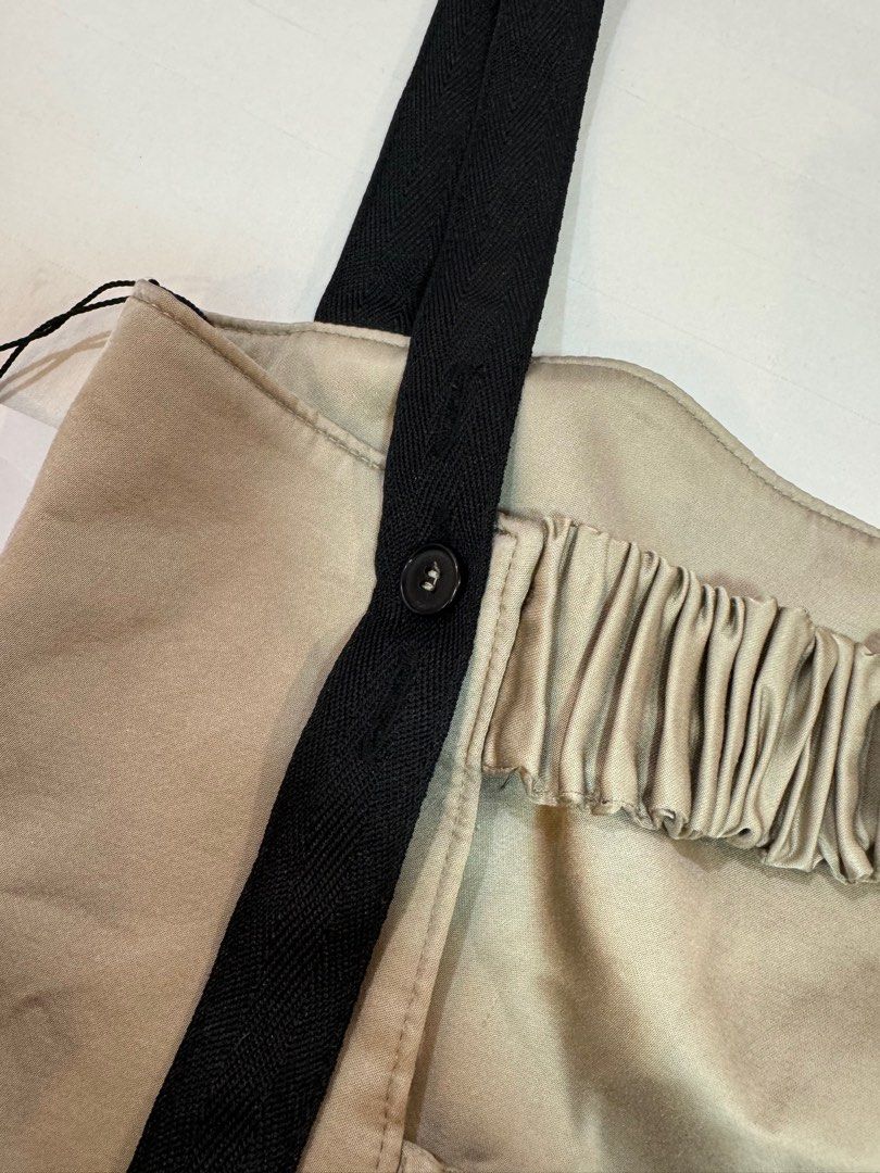 Zara Strappy Crop Top - Size S (Category: Sleeveless) located in Manila. Submitted by audsy (Listing ID 1414963488, Image 3). Description: - Zara strappy crop top (Size S) - Beige front with black straps - Button details at the back - Includes original tag - Unique gathered back design - Structured front - Perfect for a stylish, modern look.