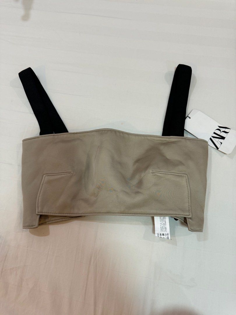 Zara Strappy Crop Top - Size S (Category: Sleeveless) located in Manila. Submitted by audsy (Listing ID 1414963488, Image 1). Description: - Zara strappy crop top (Size S) - Beige front with black straps - Button details at the back - Includes original tag - Unique gathered back design - Structured front - Perfect for a stylish, modern look.