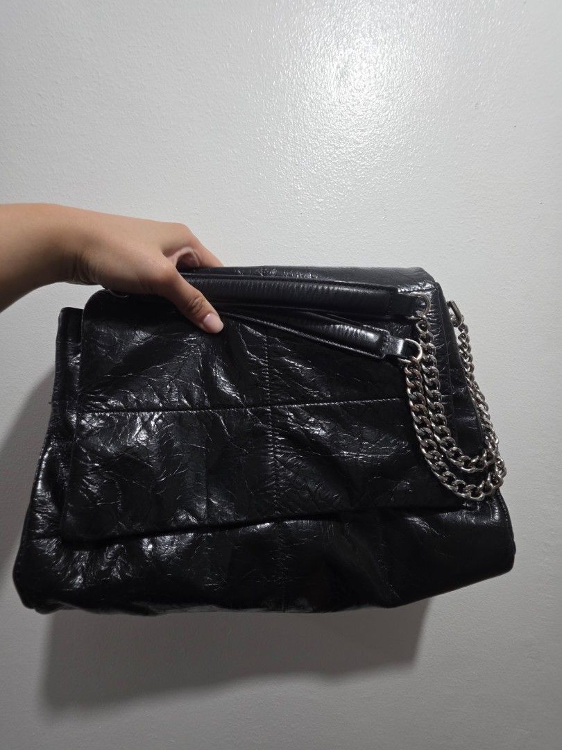 Zishen Black Shoulder Bag with Chain Strap (Category: Shoulder Bags) located in Las Pinas. Submitted by andthelike (Listing ID 1414996275, Image 3). Description: Black shoulder bag with a chain strap. Features multiple compartments. White canvas Interior lining Glossy distressed exterior Silver hardwares.