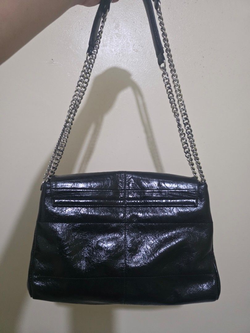 Zishen Black Shoulder Bag with Chain Strap (Category: Shoulder Bags) located in Las Pinas. Submitted by andthelike (Listing ID 1414996275, Image 2). Description: Black shoulder bag with a chain strap. Features multiple compartments. White canvas Interior lining Glossy distressed exterior Silver hardwares.
