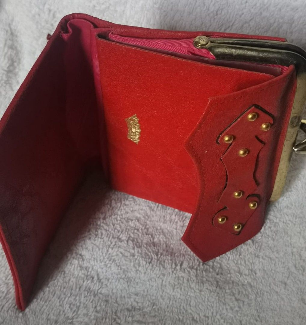 3 Wallets Bundle (Category: Wallets & Card Holders) located in Cheras. Submitted by jane---s (Listing ID 1415188387, Image 3). Description: - Bundle includes three wallets. - Brown wallet: Long design with a clasp. - Black wallet: Carlo Rino brand. - Red wallet: Unique design with gold accents..