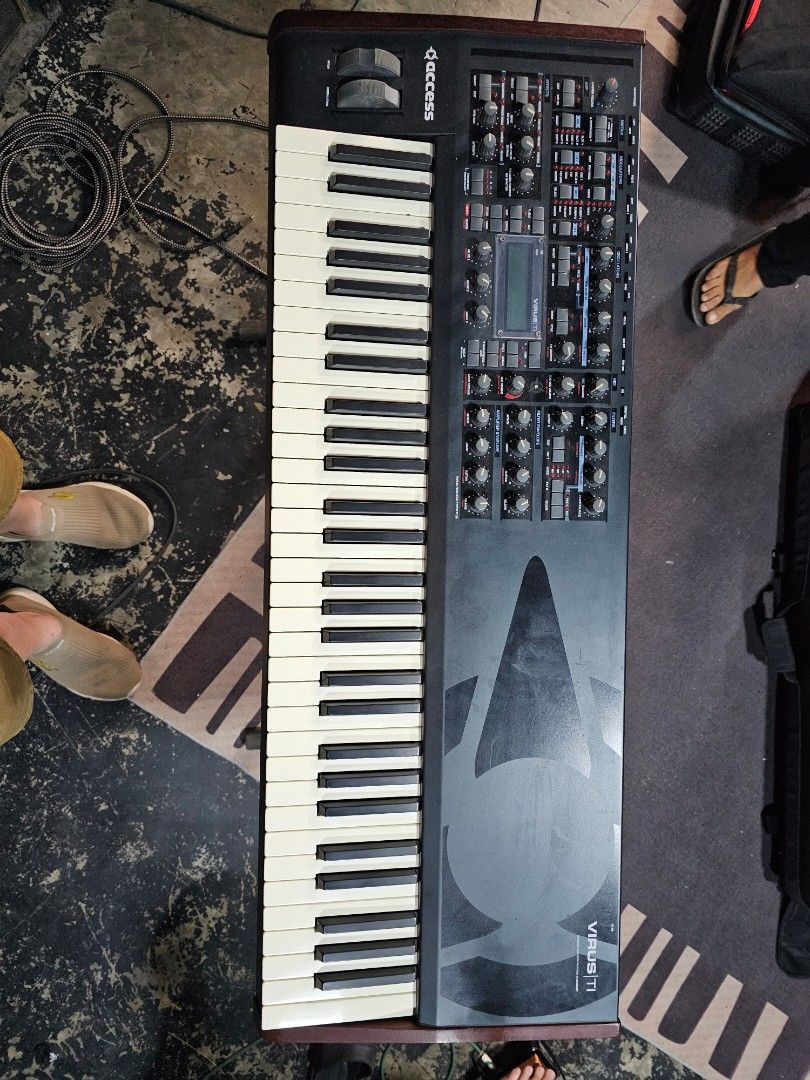 Access Virus TI 61 keyboard synthesizer (Category: Musical Instruments) located in Cebu City. Submitted by anthonyfeliciano (Listing ID 1415167850, Image 2). Description: power cable customized gig bag.