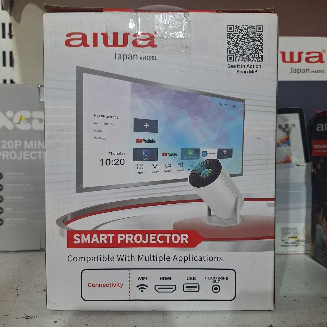 Aiwa Smart LED Projector (Category: Projectors) located in Muntinlupa City. Submitted by shopandsaveau (Listing ID 1415110337, Image 3). Description: Aiwa Smart LED Projector Surplus from Australia 720P HD Adjustable Tilt up to 120° USB Smart Apps Quick Setup 150 ANSI Lumens Built in Speaker Up to 130" Screen Compatible with Multiple Applications Connectivity: WiFi, HDMI, USB, Headphone Out.