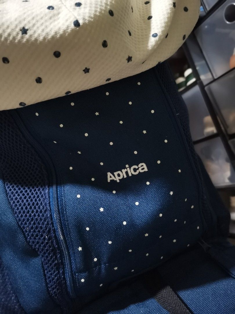 Aprica Baby Carrier (Category: Carriers & Slings) located in Manila. Submitted by buchoi (Listing ID 1415047253, Image 2). Description: - Aprica baby carrier - Color: Navy blue - Features a white patterned insert - Adjustable straps and buckles - Secure and comfortable.