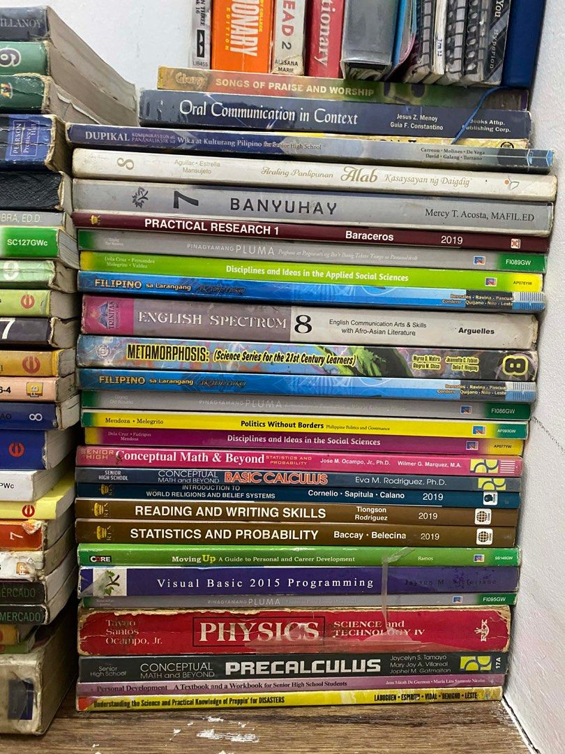 Assorted Educational Books (Category: Textbooks) located in Manila. Submitted by bravedolphin-614f (Listing ID 1415155415, Image 1). Description: - Collection of educational books. - Subjects include physics, mathematics, English, and science. - Titles like "Physics", "Precalculus", "English Spectrum 8", "Science @ Work", and "Oral Communication in Context". - Ideal for students and knowledge seekers. - Titles and editions may vary..