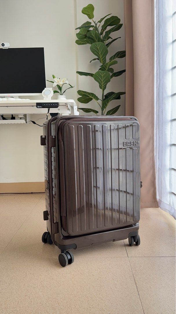 BASH Medium Luggage + BASH Luggage Cover (Category: Luggage) located in Basud. Submitted by declutterhour (Listing ID 1415137925, Image 2). Description: BASH MNL LUGGAGE in Terra + BASH MNL LUGGAGE COVER in Slate + FREE Island Elephant Luggage Cover ✅ RFS: Will Buy Bigger Size ✅ Used only once in Hong Kong ✅ Like New ✅ You can ask for more video just message me - Stylish brown BASH luggage - Sleek, modern design - Durable exterior with vertical r