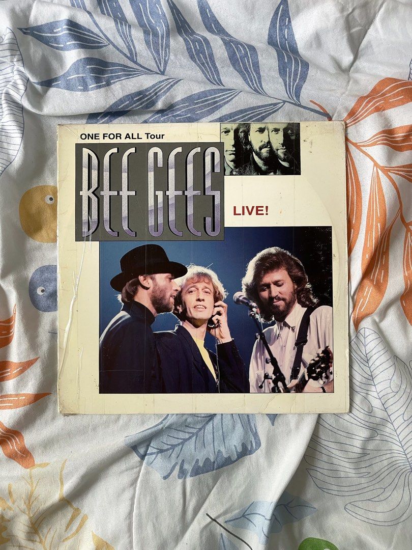 BEE GEES (Category: Vinyls) located in Roxas City. Submitted by strgrllv (Listing ID 1415092641, Image 1). Description: BEE- GEES Price: 500 (fixed) Condition: Used / Vintage. Open with visible signs of usage on the sleeve (scuffs/edge wear). The disc is in good condition. Note: This is a LaserDisc (12-inch video disc), not a vinyl record. Great for collectors and fans! MOP: Gcash only J&T/ Flash Express/ LBC.