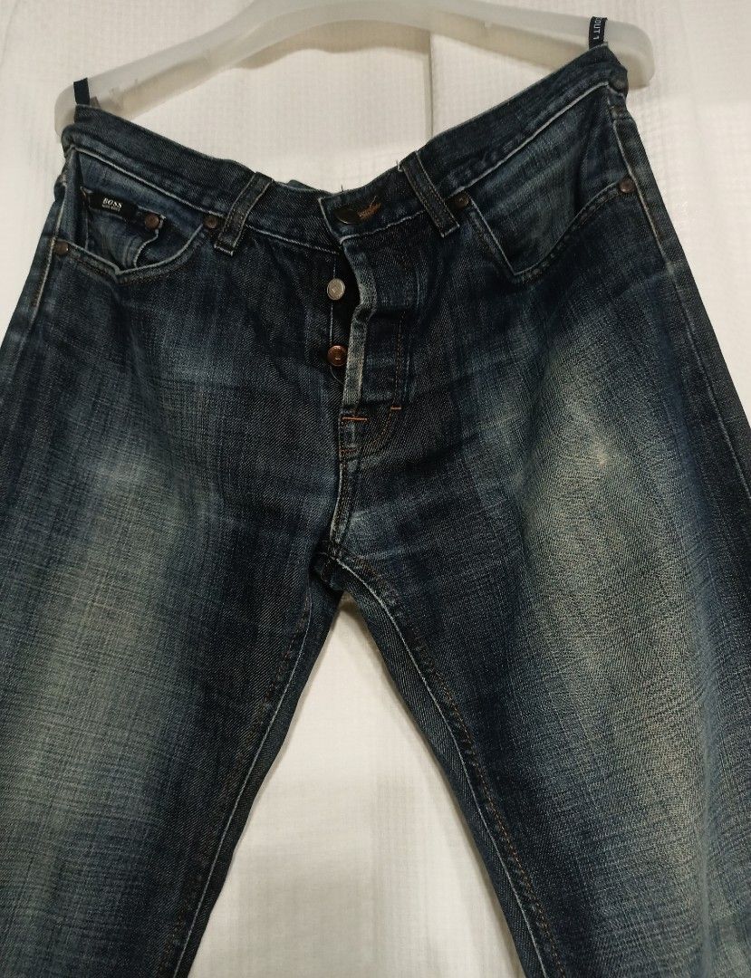 BOSS Hugo Boss Jeans (Category: Jeans) located in Cavite. Submitted by ag_closet (Listing ID 1415049102, Image 2). Description: - BOSS Hugo Boss jeans - Dark wash - Button fly - Classic five-pocket design - Regular fit - Leather BOSS logo patch - Came from UAE PM for more details! ✨.