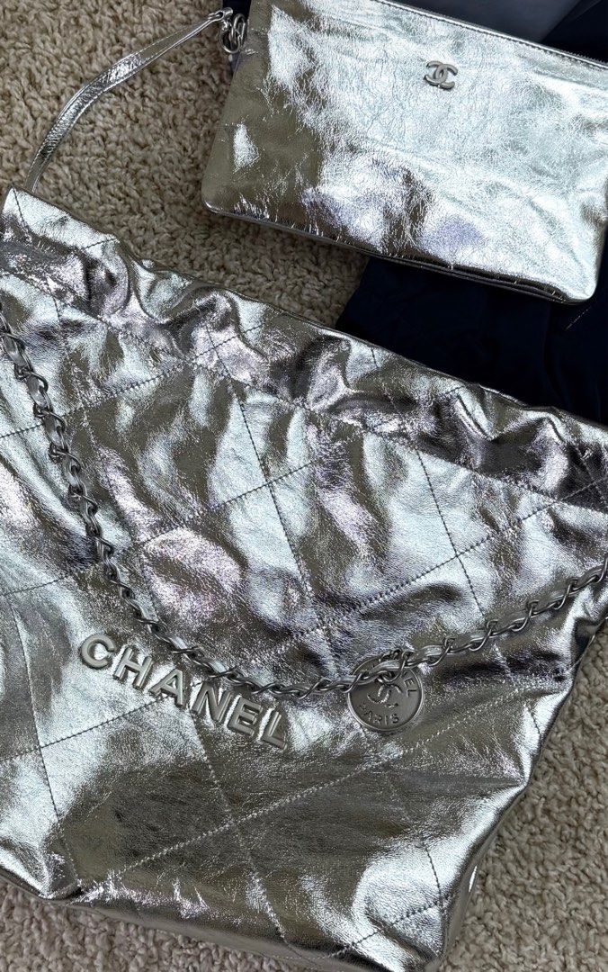 Chanel 22 silver (Category: Luxury Bags & Wallets) located in Silang. Submitted by girlyouneedthis (Listing ID 1390049927, Image 1). Description: Chanel 22 in Silver calf skin leather from Cruise collection. Comes with box and dustbag. No returns, No exchange, No refunds..