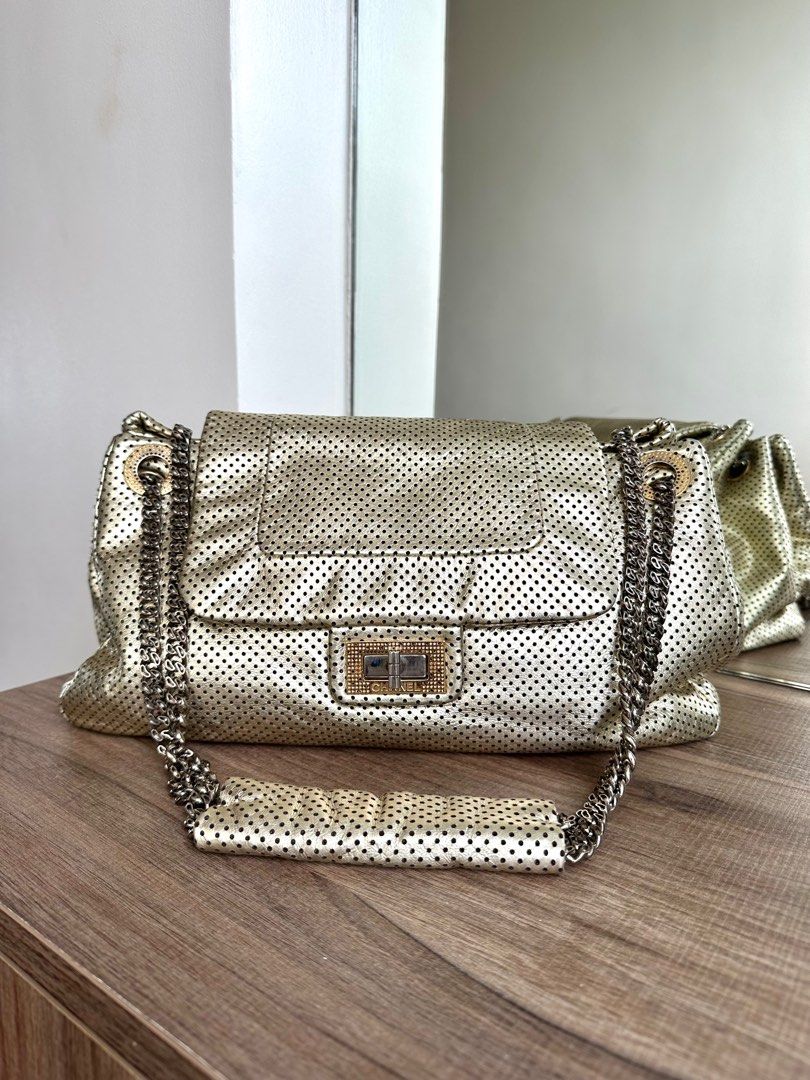 Chanel Perforated Leather Shoulder Bag (Category: Luxury Bags & Wallets) located in Quezon City. Submitted by alysstrade (Listing ID 1415114118, Image 1). Description: - Authentic Chanel shoulder bag - Gold perforated leather - Chain strap - Flap closure with logo detail - Main compartment - Slip pocket - Includes authenticity card - Made in Italy.