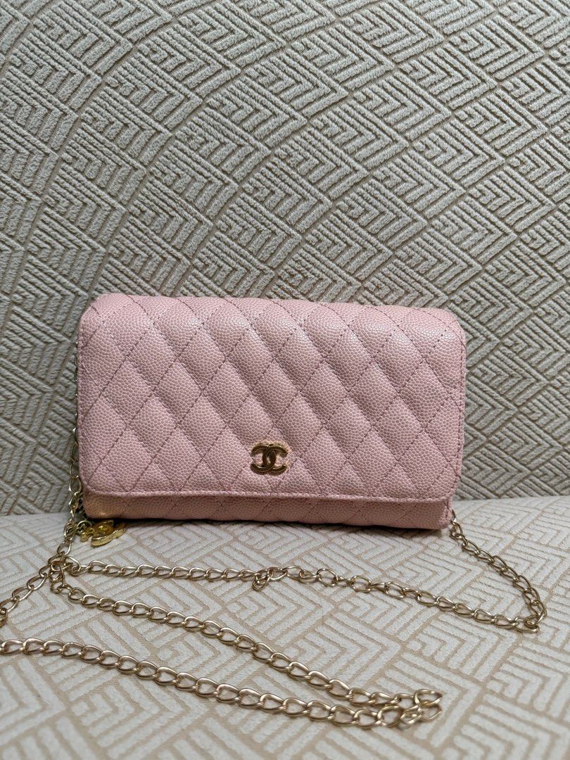 Chanel Wallet on Chain Pink (Category: Luxury Bags & Wallets) located in Manila. Submitted by jj11662 (Listing ID 1415174114, Image 1). Description: PRICE IS NEGOTIABLE PM FOR MORE DETAILS! - Chanel Wallet on Chain - Light pink quilted leather exterior - Elegant gold chain strap - Iconic gold Chanel logo - Interior with multiple compartments - Includes a zippered pocket - Secure flap closure.