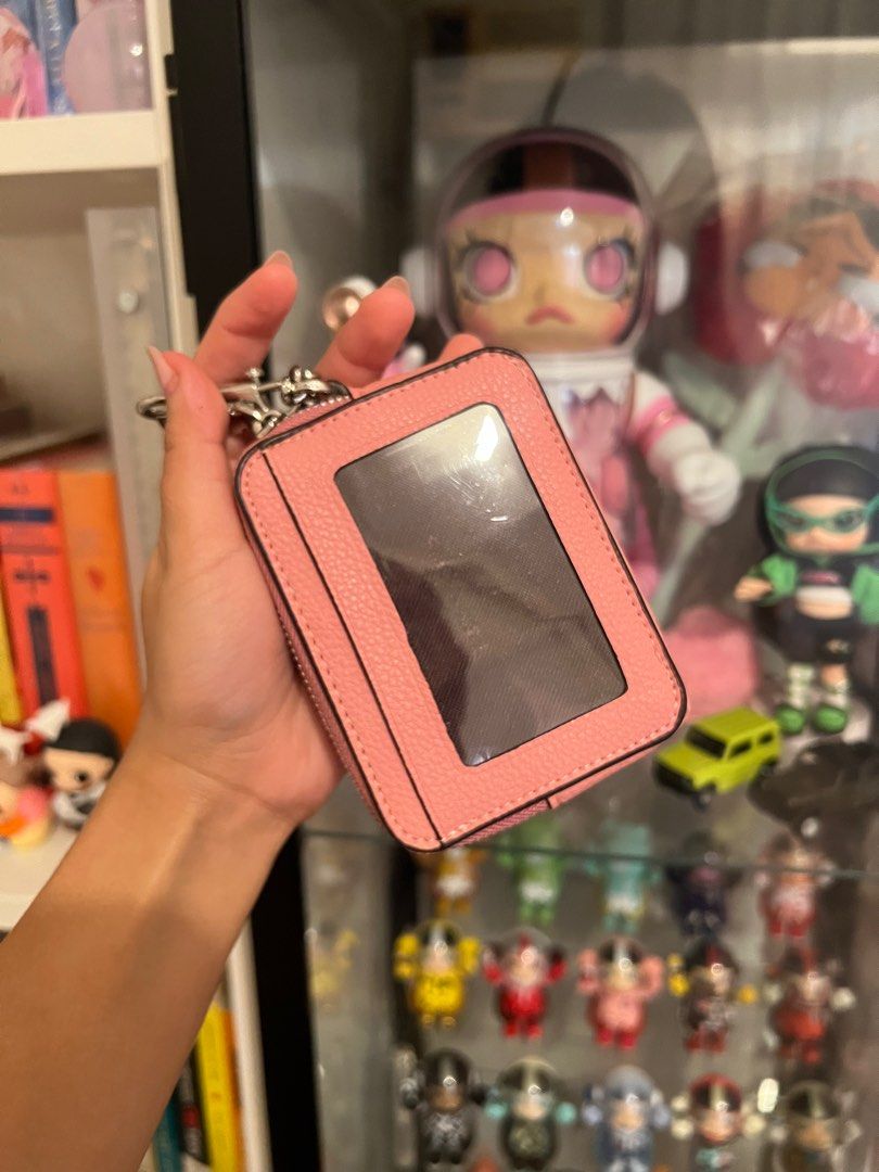 Coach Pink Card Case with Chain (Category: Luxury Bags & Wallets) located in Pasay City. Submitted by chii.b (Listing ID 1415142857, Image 2). Description: Coach card case is a lovely pink color. It features a zip-around closure and a chain for easy carrying. The front has card slots and the back has a clear window. The original tag is still attached. Inside, there are multiple compartments for cards and cash..