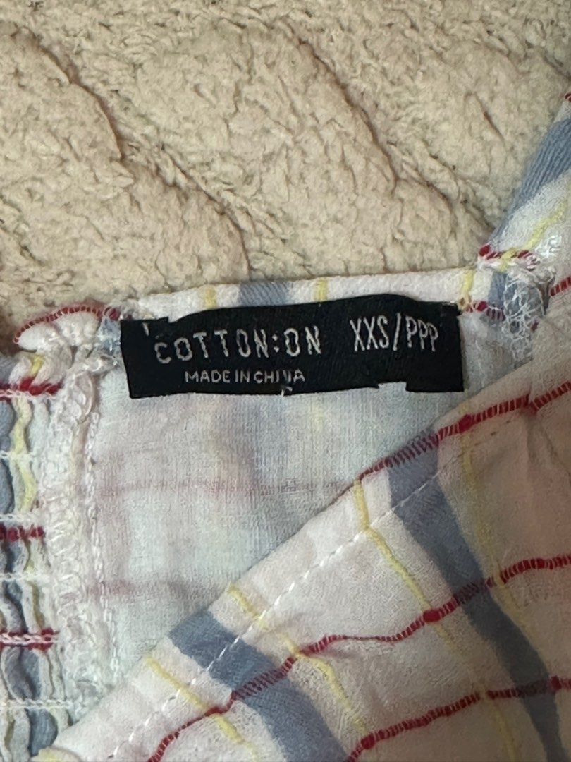 Cotton On Plaid Crop Top (Category: Others Tops) located in Taguig. Submitted by sassythrifter (Listing ID 1415082762, Image 2). Description: - Cotton On crop top - Plaid pattern - Square neckline - Puffed sleeves - Ruched front with tie detail - Smocked back panel - Size: XXS/PPP - Made in China.