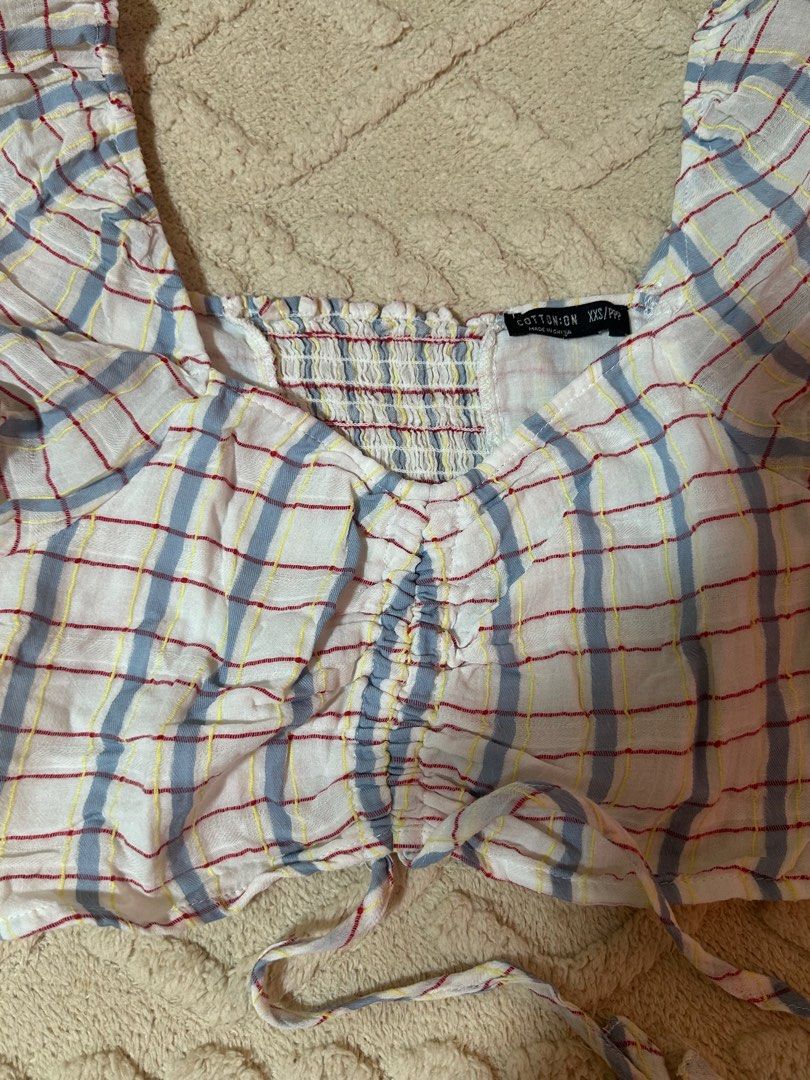 Cotton On Plaid Crop Top (Category: Others Tops) located in Taguig. Submitted by sassythrifter (Listing ID 1415082762, Image 3). Description: - Cotton On crop top - Plaid pattern - Square neckline - Puffed sleeves - Ruched front with tie detail - Smocked back panel - Size: XXS/PPP - Made in China.