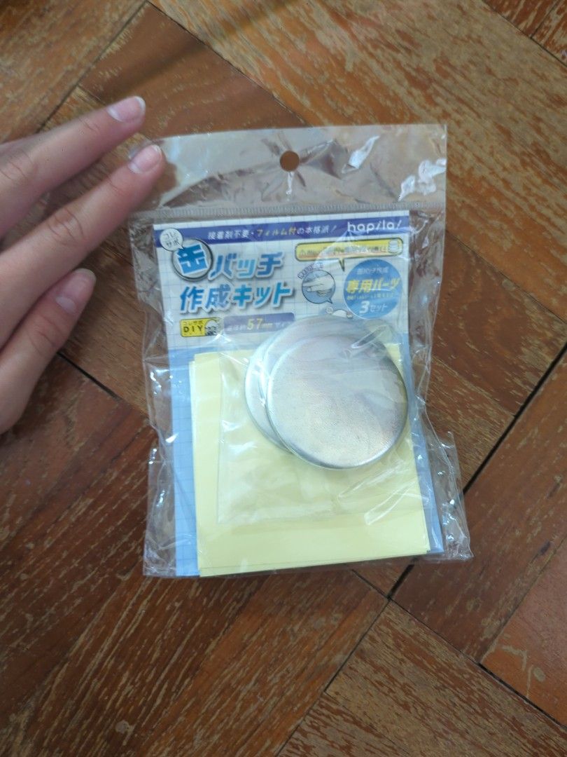 DIY Button Making Kit (Category: Craft Supplies & Tools) located in Singapore. Submitted by juliet52637 (Listing ID 1415134387, Image 1). Description: Unused button making kit. Includes metal circles, paper, and instructions. Perfect for creating custom buttons. Great for crafting or personalizing items..