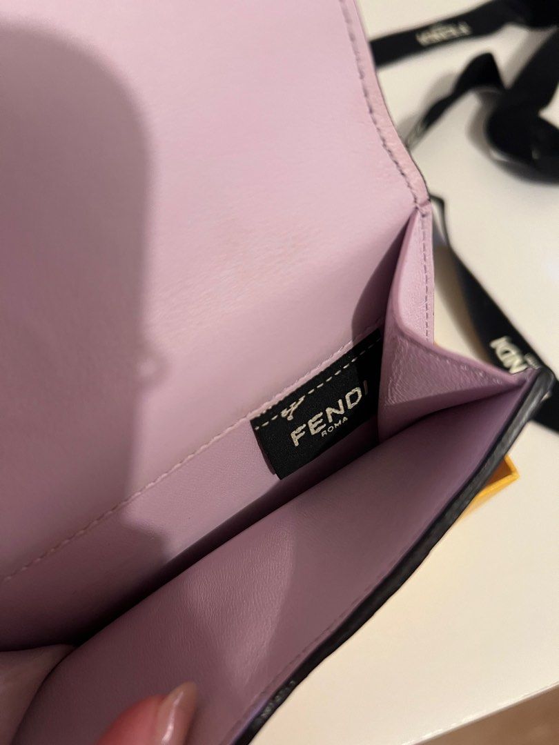 Fendi Peekaboo Wallet (Category: Luxury Bags & Wallets) located in Pasay City. Submitted by chii.b (Listing ID 1415143186, Image 3). Description: - Authentic Fendi Peekaboo wallet - Soft lavender color - Gold-tone clasp - Multiple card slots - Includes original box, dust bag, and authenticity cards - Made in Italy.