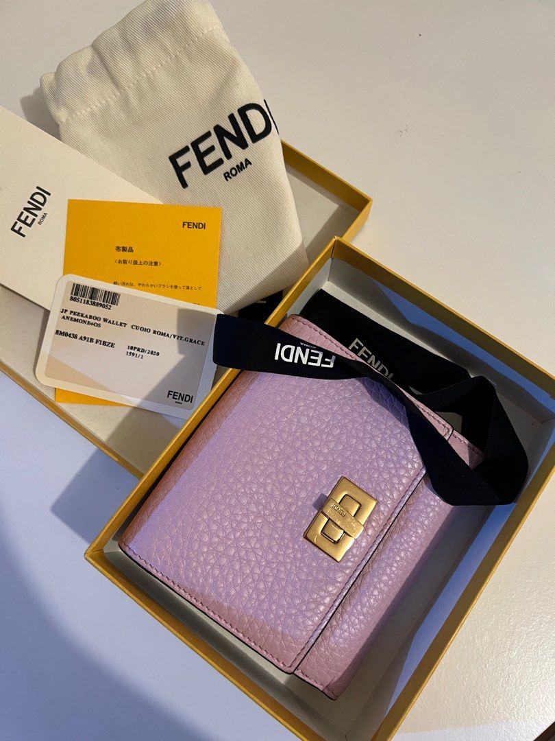 Fendi Peekaboo Wallet (Category: Luxury Bags & Wallets) located in Pasay City. Submitted by chii.b (Listing ID 1415143186, Image 1). Description: - Authentic Fendi Peekaboo wallet - Soft lavender color - Gold-tone clasp - Multiple card slots - Includes original box, dust bag, and authenticity cards - Made in Italy.