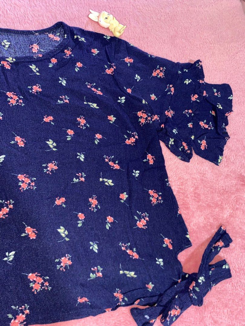 Floral Navy Blouse with Ruffle Sleeves (Category: Blouses) located in Manila. Submitted by rielilac (Listing ID 1415150425, Image 2). Description: - Navy blue blouse - Floral pattern - Ruffle sleeves - Tie detail on the side - Lightweight fabric - Casual wear.