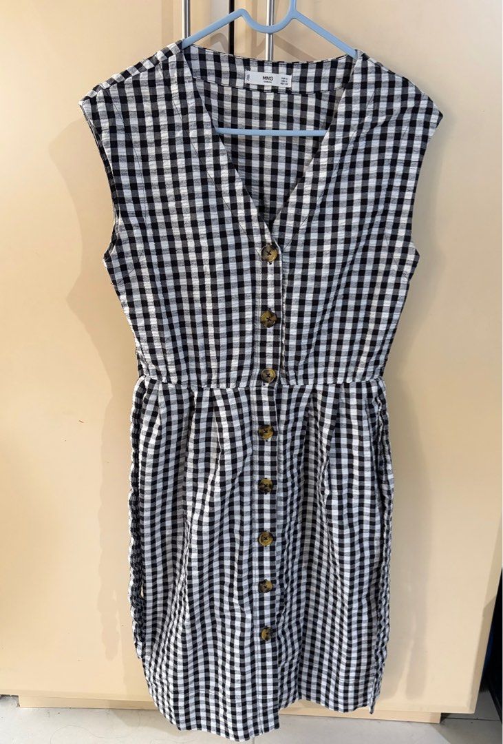 Gingham Check Dress with Belt (Category: Dresses) located in Taguig. Submitted by aopreloveditems (Listing ID 1415079965, Image 1). Description: - Black and white gingham check dress - V-neckline - Includes matching belt - Sleeveless - Midi length - Perfect for various occasions Dimensions when laid flat: Length: 37.5 in Waist: 13 in Bust: 15.5 in MOP: BPI, GCash Shipping within MM only. SF to be shouldered by buyer. .