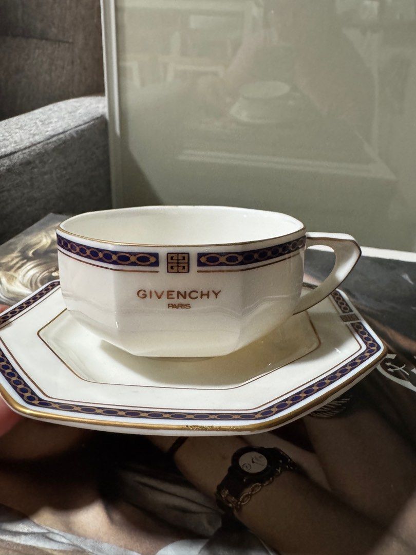 Givenchy Paris Tea Cup and Saucer Set (Category: Coffee & Tea Tableware) located in Manila. Submitted by camshomecollections888 (Listing ID 1415076658, Image 2). Description: - Givenchy tea cup and saucer set - White cup and saucer with gold and navy blue accents - Features the Givenchy logo - Octagonal saucer shape - Perfect for tea set collectors Japan givenchy paris cup and saucer.