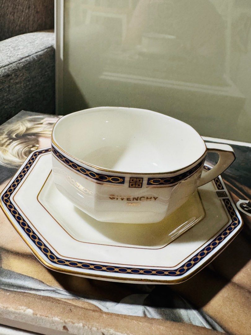 Givenchy Paris Tea Cup and Saucer Set (Category: Coffee & Tea Tableware) located in Manila. Submitted by camshomecollections888 (Listing ID 1415076658, Image 3). Description: - Givenchy tea cup and saucer set - White cup and saucer with gold and navy blue accents - Features the Givenchy logo - Octagonal saucer shape - Perfect for tea set collectors Japan givenchy paris cup and saucer.