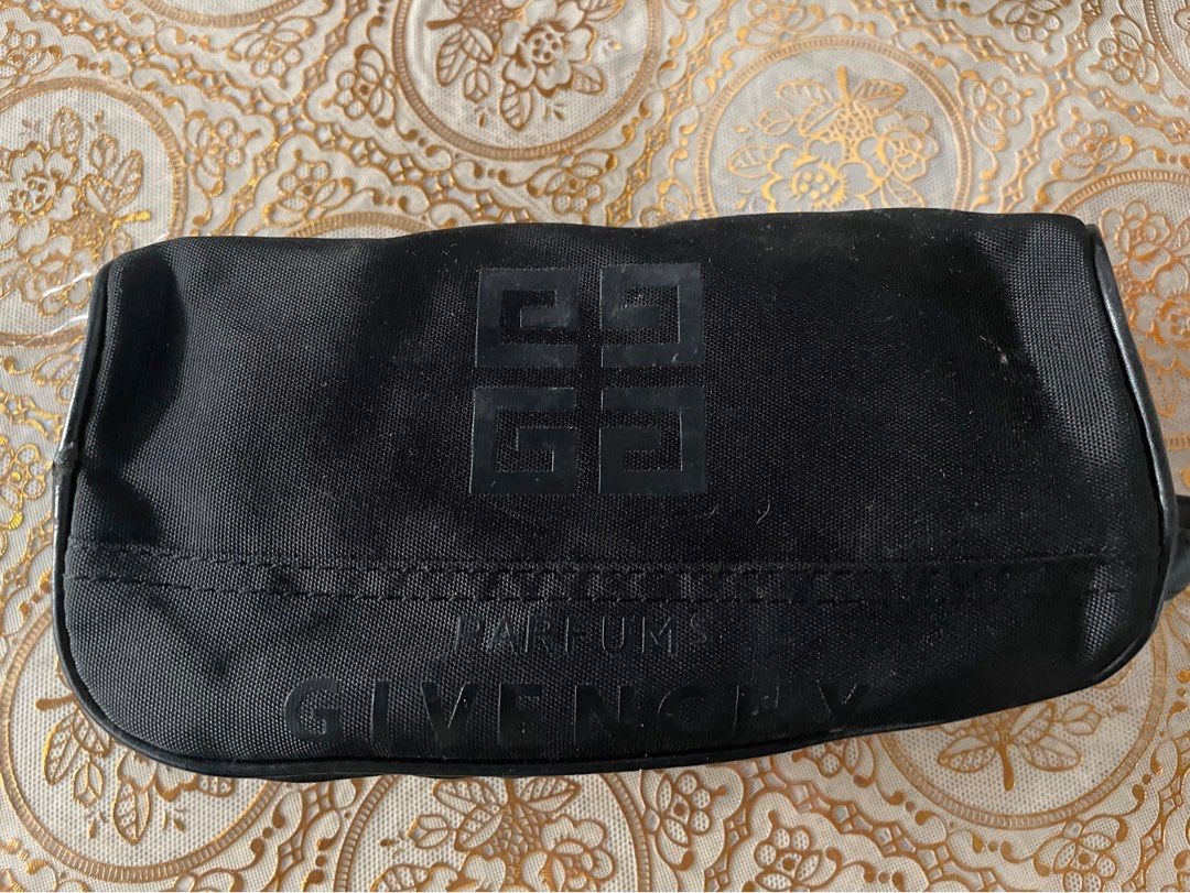 GIVENCHY Pouch (Category: Luxury Bags & Wallets) located in Iligan City. Submitted by ileganteph (Listing ID 1415137174, Image 1). Description: Very Good Condition No major flaws With etikita.