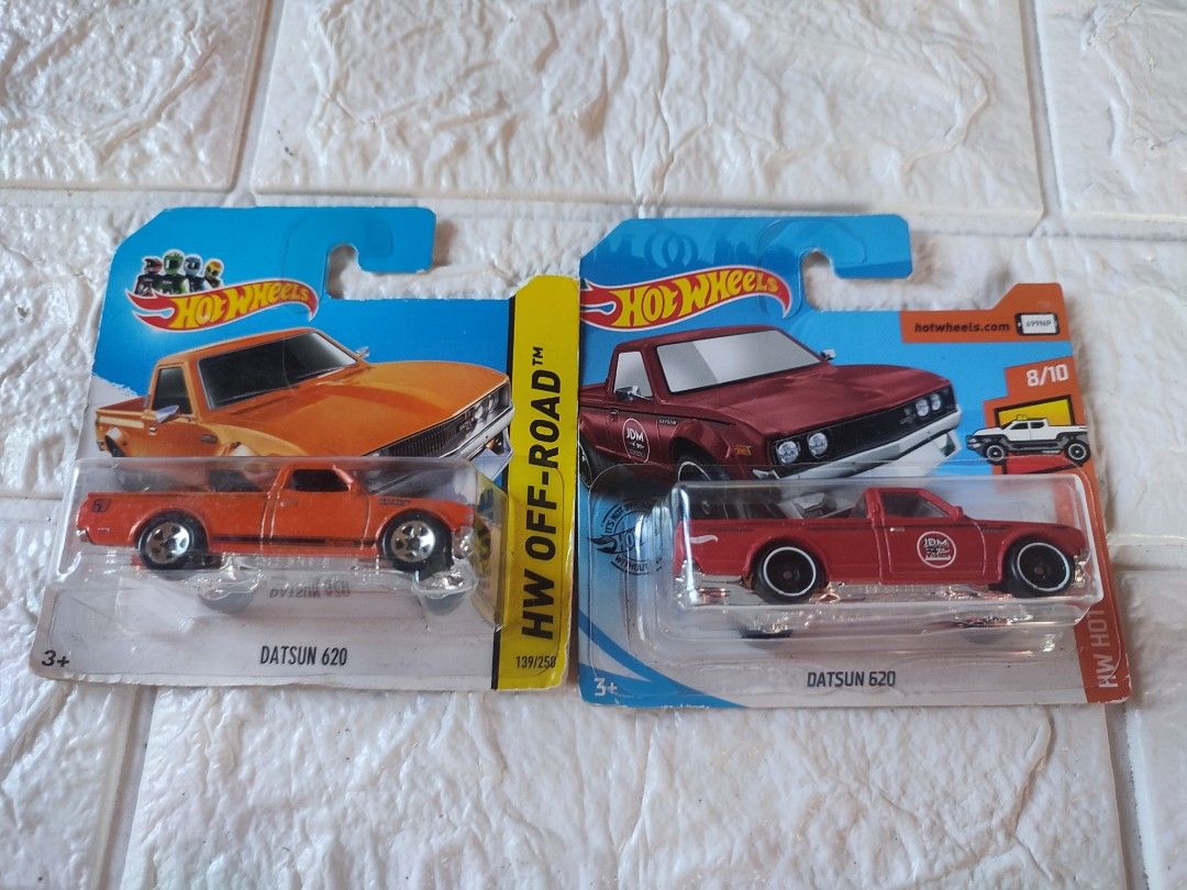 Hot Wheels Datsun 620 (Category: Vehicle & Diecast Models) located in Narvacan. Submitted by jigger85 (Listing ID 1415125987, Image 1). Description: - Two Hot Wheels Datsun 620 diecast cars - One orange, one red - Both from the HW Off-Road series - Orange: 2020 HW Hot Trucks, 182/250 - Red: 8/10 series - Both in original packaging.