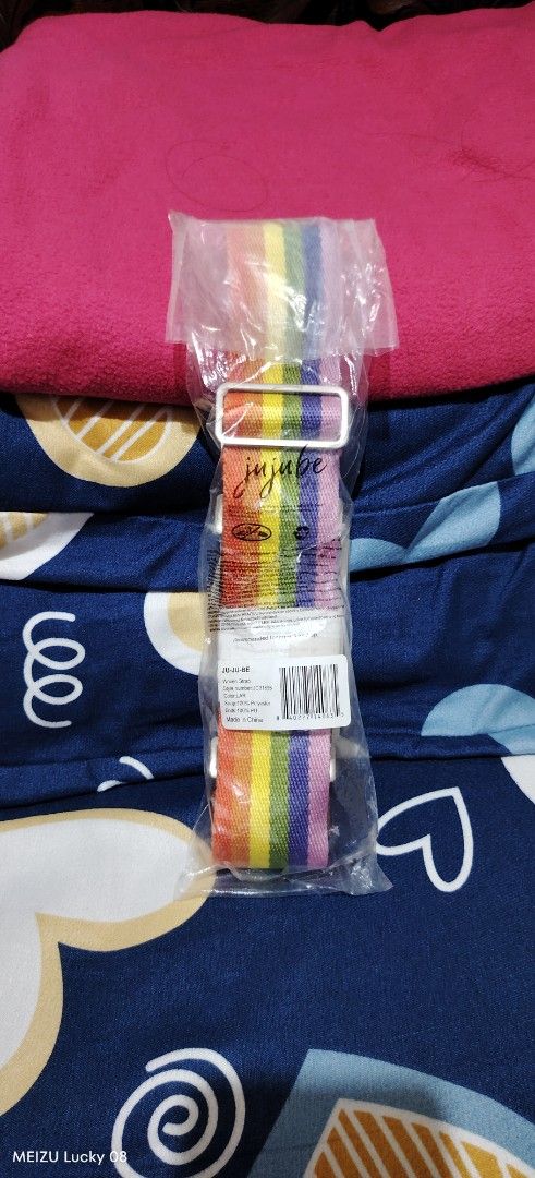 JuJuBe Rainbow Strap (Category: Diaper Bags & Wetbags) located in Infanta. Submitted by magentachipmunk497 (Listing ID 1415117709, Image 1). Description: - JuJuBe rainbow strap - Brand new, in original packaging - Colorful striped design - White buckle - JuJuBe logo visible - For bags.