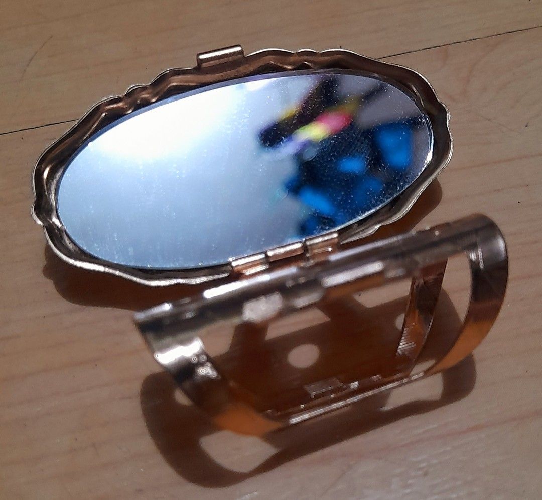 Lipstick Holder with Mirror (Category: Makeup) located in Manila. Submitted by miamiga (Listing ID 1415126898, Image 3). Description: Size: 1.1" x 2.2" - Metal lipstick holder with a mirror - with light scratches and dirt.